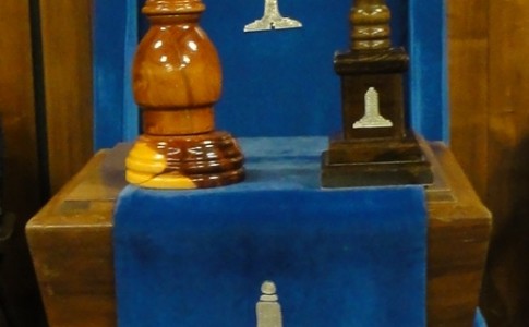 The Chair in the West, with jewel, apron, pillar, and gavel.