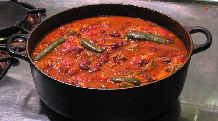 A bowl of chili on the stove
